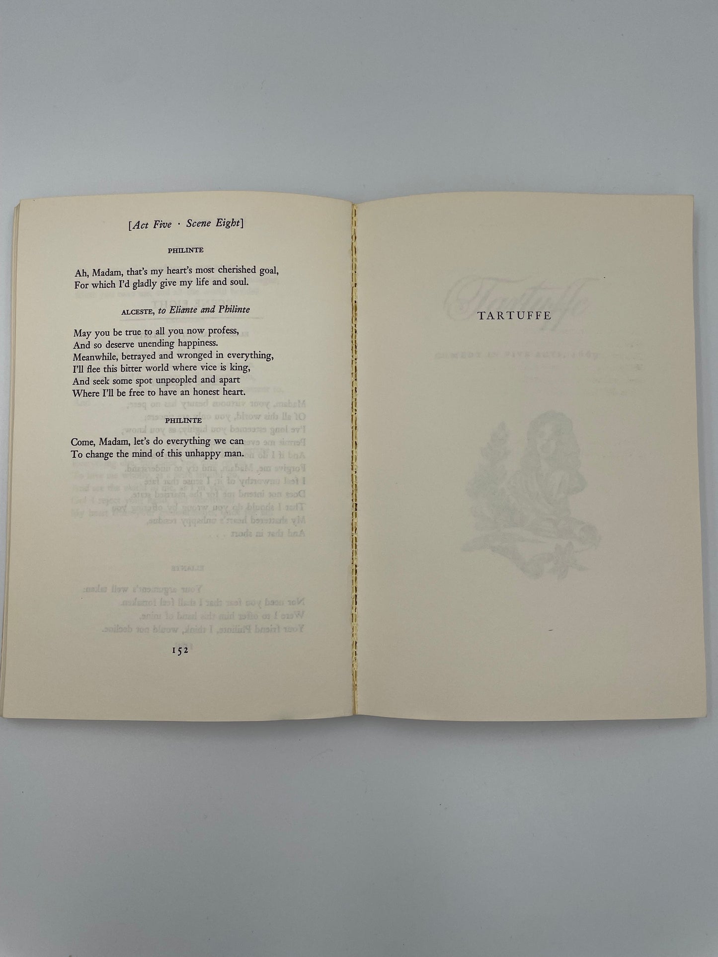 Open book with text and decorative elements on a gray background from ‘Molière: The Misanthrope and Tartuffe’.