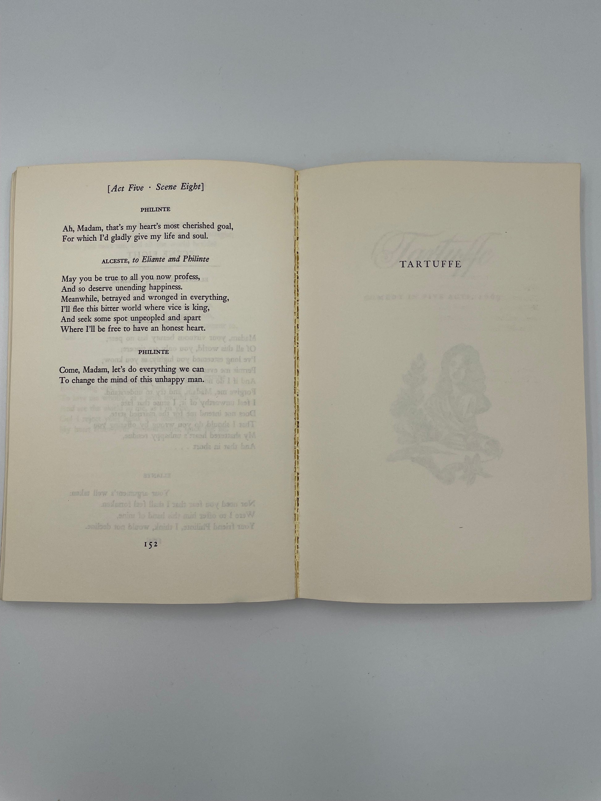 Open book with text and decorative elements on a gray background from ‘Molière: The Misanthrope and Tartuffe’.