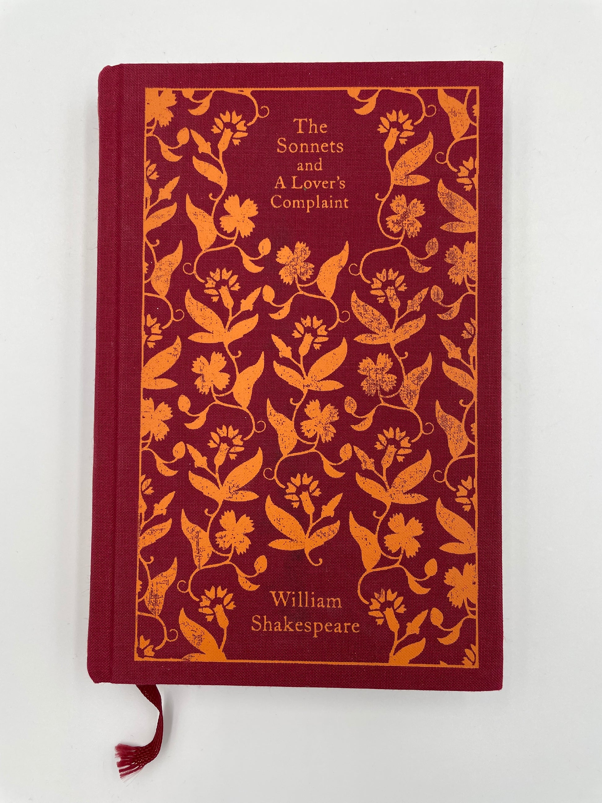 Book cover of, 'The Sonnets and A Lover’s Complaint' by William Shakespeare with floral patterns and text on a white background