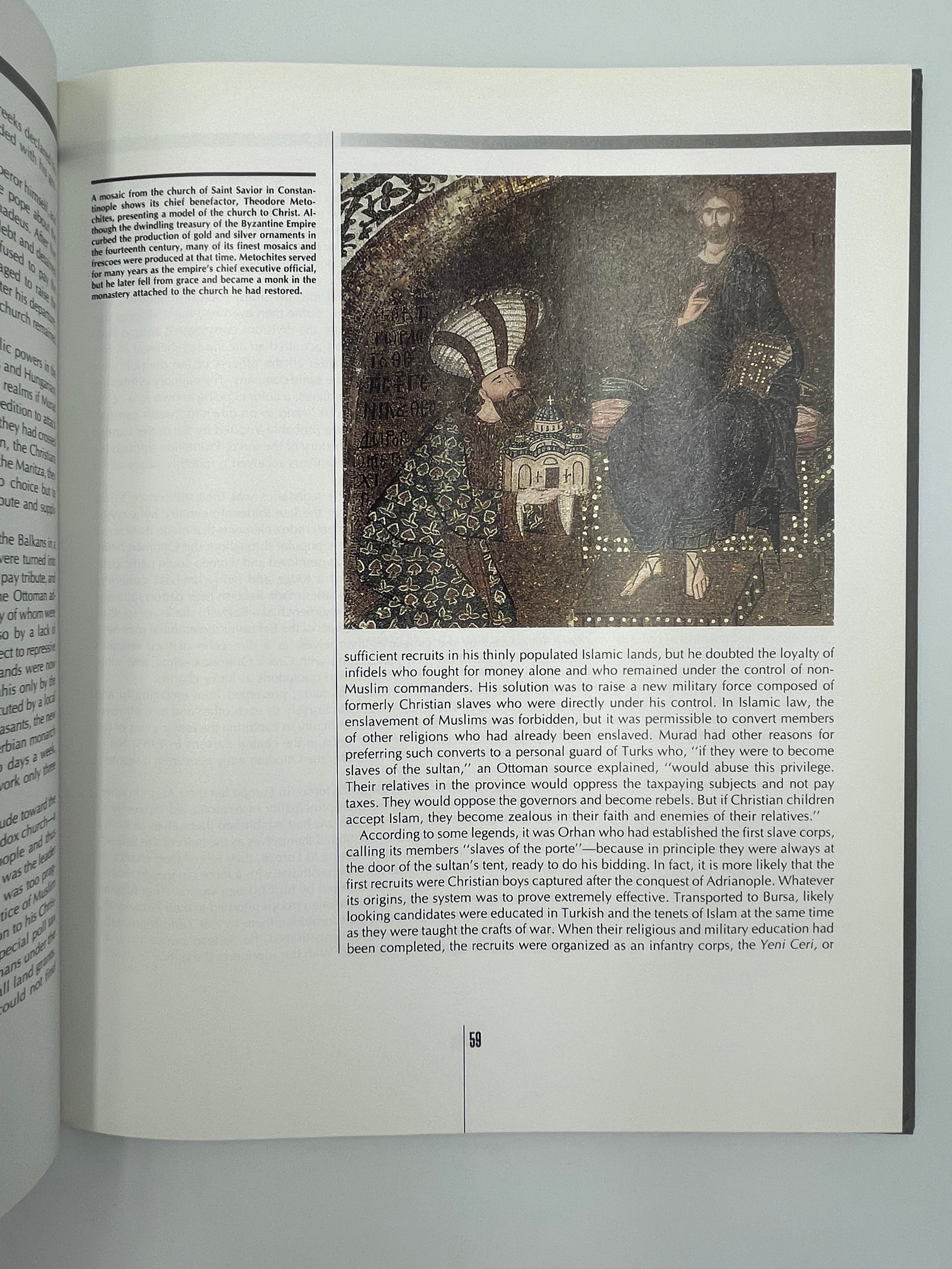 Inside page of book  'Time Frame A.D. 1300-1400' on framed artwork with text on a white wall