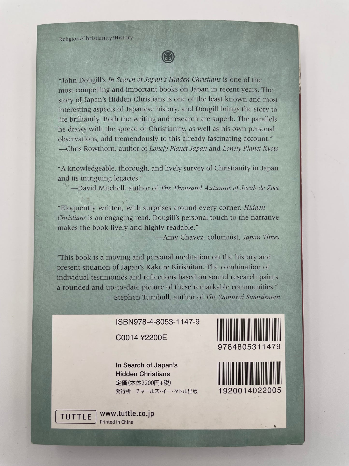 Back book cover of 'In Search of Japan’s Hidden Christians' by John Dougill.with text and a barcode on a white background