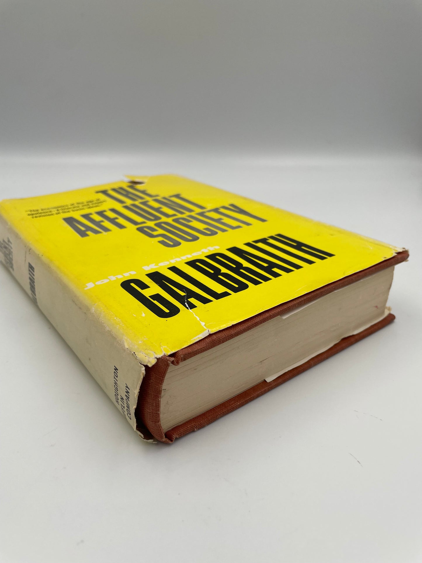 Side view of book, ‘The Affluent Society’ by John Kenneth Galbraith