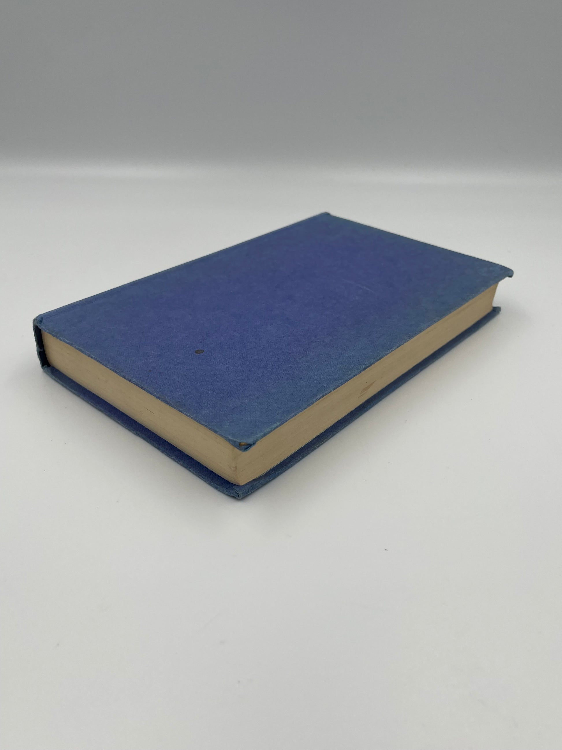 Blue book on a white background.