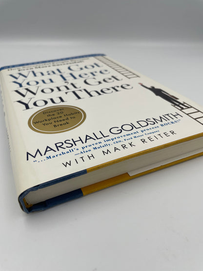 Angled view with book edge of "What Got You Here Won't Get You There: How Successful People Become Even More Successful" by
Marshall Goldsmith  with Mark Reiter 