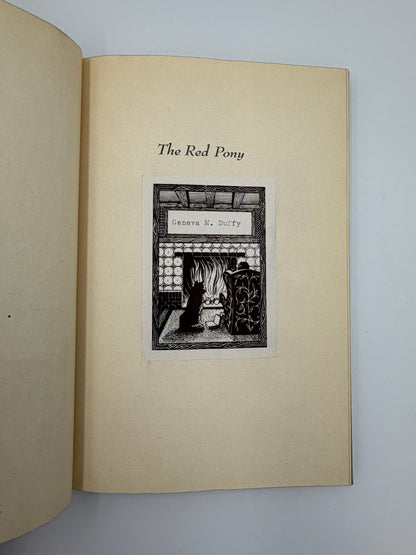 Old ex libris sticker on page from the book, 'The Red Pony' by John Steinbeck. 