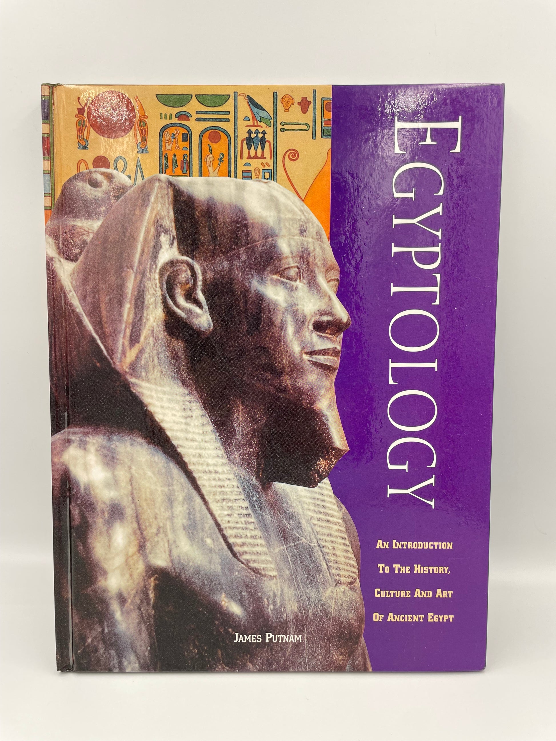 Book titled 'Egyptology' with an image of an Egyptian sarcophagus on the cover.
