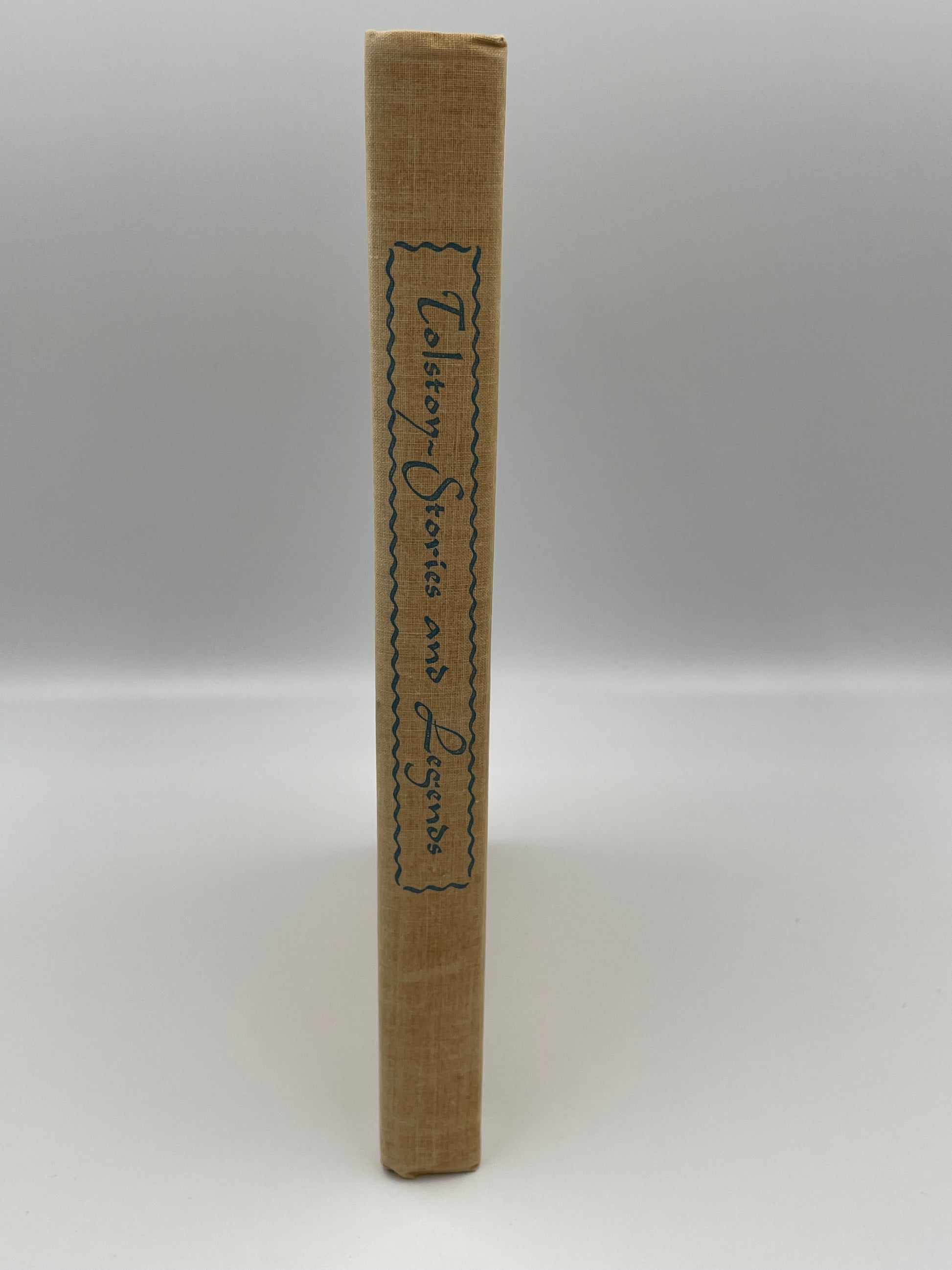 Book spine of 'Tolstoy: Stories and Legends' text on a white background