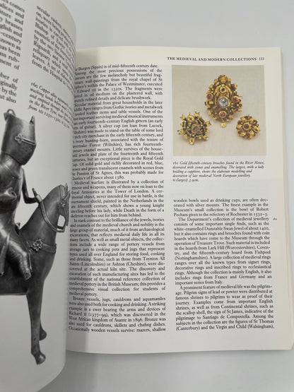 Open book with illustrations of jewelry and a knight on a horse, on a white background